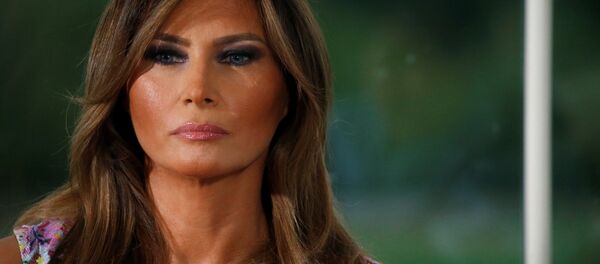 First lady Melania Trump listens as her husband U.S. President Donald Trump speaks at a dinner with business leaders at Trump National Golf Club in Bedminster, New Jersey, U.S., August 7, 2018 - Sputnik International