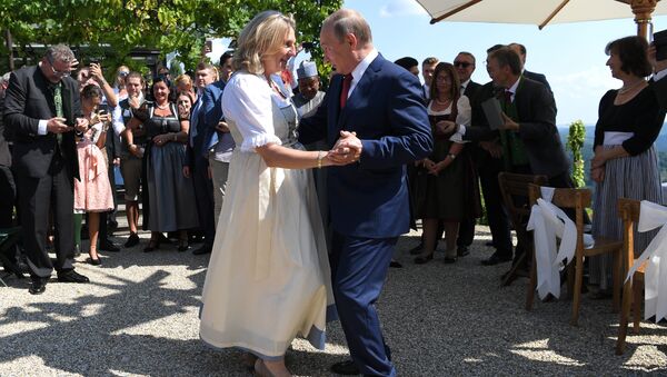Russian President Vladimir Putin dances with Austrian Foreign Minister Karin Kneissl. File photo - Sputnik International