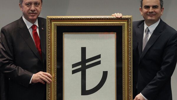 Turkish Prime Minister Recep Tayyip Erdogan, left, and former Central Bank Governor Erdem Basci show the symbol for the national currency, the Turkish lira, in Ankara, Turkey. - Sputnik International