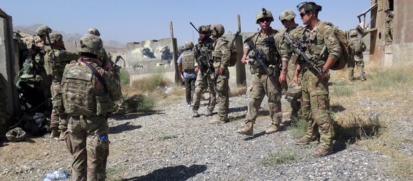 U.S. military advisers from the 1st Security Force Assistance Brigade are seen at an Afghan National Army base in Maidan Wardak province, Afghanistan August 6, 2018 - Sputnik International