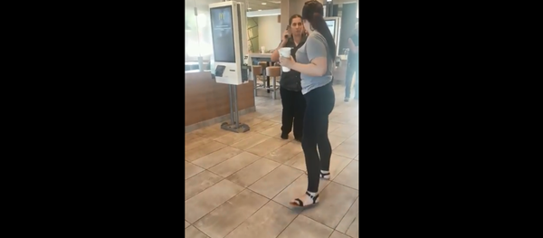 Cellphone footage shows McDonald's employee flinging phone at customer after being spat on - Sputnik International