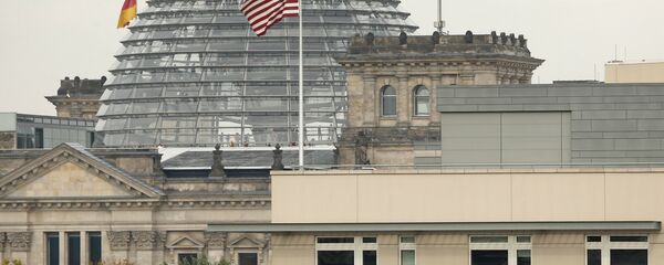 American flag flies on top of the U.S. embassy in front of the Reichstag building that houses the German Parliament, Bundestag, in Berlin, Germany (File) American flag flies on top of the U.S. embassy in front of the Reichstag building that houses the German Parliament, Bundestag, in Berlin, Germany (File) - Sputnik International