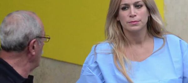 Aurea Vasquez Rijos' trial for her alleged involvement in her husband's 2005 murder is expected to begin on Tuesday. She is pictured above after she was extradited to Puerto Rico in 2015 - Sputnik International