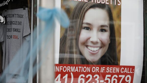A poster for missing University of Iowa student Mollie Tibbetts hangs in the window of a local business, Tuesday, Aug. 21, 2018, in Brooklyn, Iowa - Sputnik International