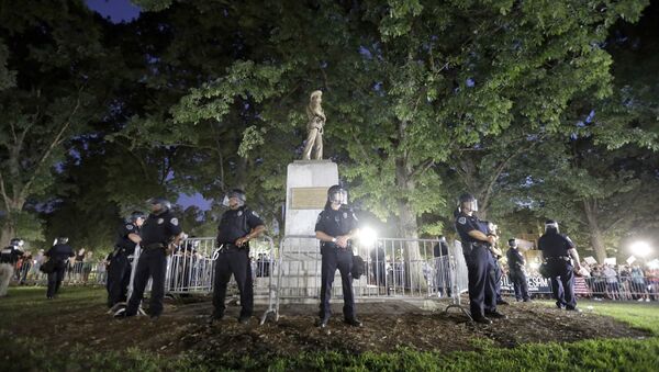 In this Tuesday, Aug. 22, 2017 file photo, police surround the Silent Sam Confederate monument during a protest to remove the statue at the University of North Carolina in Chapel Hill, N.C.  - Sputnik International