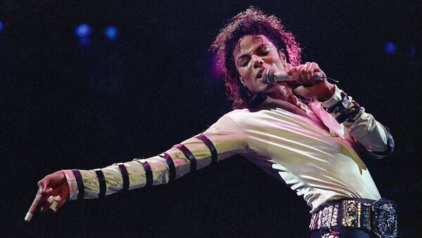 In this Feb. 24, 1988 file photo, Michael Jackson leans, points and sings, dances and struts during the opening performance of his 13-city U.S. tour, in Kansas City - Sputnik International