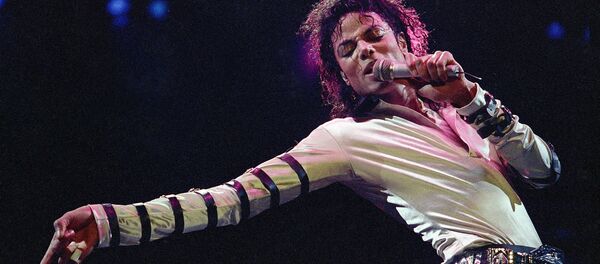 In this Feb. 24, 1988 file photo, Michael Jackson leans, points and sings, dances and struts during the opening performance of his 13-city U.S. tour, in Kansas City - Sputnik International