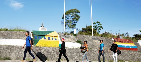 Migrantes venezolanos en la frontera entre Brasil y Venezuela - Sputnik International