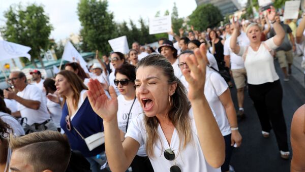 Public school teachers shout slogans during a protest against educational reforms in Nicosia, Cyprus August 28, 2018 - Sputnik International