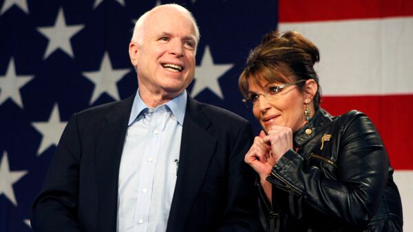 U.S. Senator John McCain (R-AZ) and former Alaska Governor and vice presidential candidate Sarah Palin acknowledge the crowd during a campaign rally for McCain at the Pima County Fairgrounds in Tucson, Arizona March 26, 2010 - Sputnik International