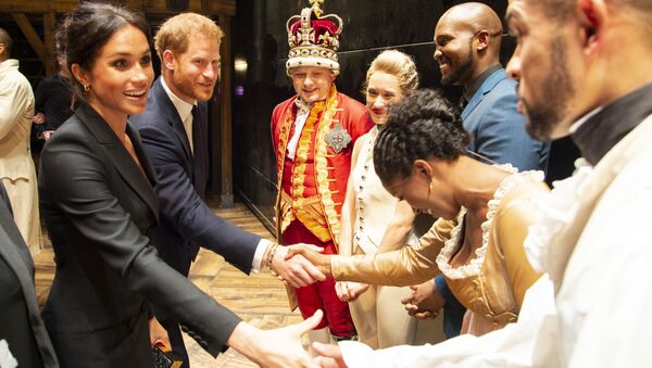 Britain's Prince Harry, Duke of Sussex, (2L) and Britain's Meghan, Duchess of Sussex (L) meet members of the cast and crew backstage after a gala performance of the musical 'Hamilton' in support of the charity Sentebale at the Victoria Palace Theatre in London on August 29, 2018 - Sputnik International