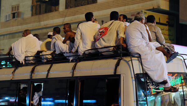 Muslim pilgrims sit on top of a bus heading to the Grand Mosque in Mecca (File) - Sputnik International