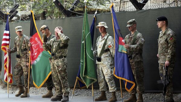 Afghanistan and NATO soldiers hold their flags before the start of the change of command ceremony at Resolute Support headquarters, in Kabul, Afghanistan, Sunday, Sept. 2, 2018 - Sputnik International