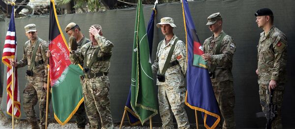 Afghanistan and NATO soldiers hold their flags before the start of the change of command ceremony at Resolute Support headquarters, in Kabul, Afghanistan, Sunday, Sept. 2, 2018 Afghanistan and NATO soldiers hold their flags before the start of the change of command ceremony at Resolute Support headquarters, in Kabul, Afghanistan, Sunday, Sept. 2, 2018 - Sputnik International