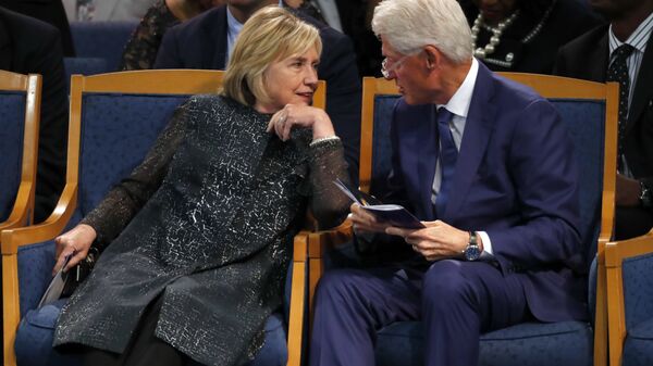Former President Bill Clinton and wife Hillary Clinton, left, talking during the funeral service for Aretha Franklin at Greater Grace Temple, Friday, Aug. 31, 2018, in Detroit - Sputnik International