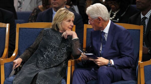 Former President Bill Clinton and wife Hillary Clinton, left, talking during the funeral service for Aretha Franklin at Greater Grace Temple, Friday, Aug. 31, 2018, in Detroit - Sputnik International