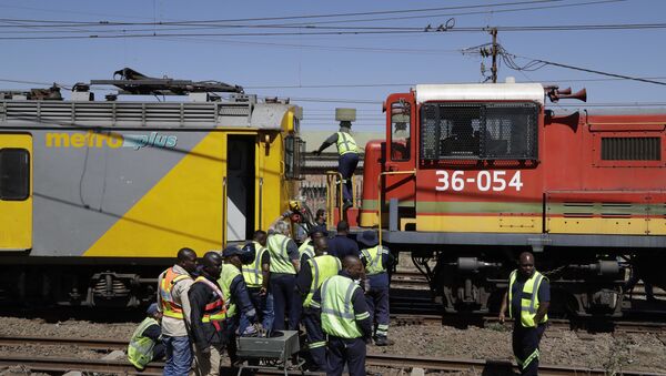 The scene of an early morning train collision in a suburb of Johannesburg Tuesday, Sept. 4, 2018 - Sputnik International