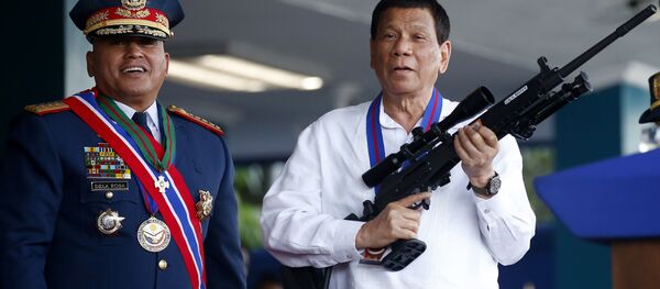 Philippine President Rodrigo Duterte, right, holds an Israeli-made Galil rifle which was presented to him by former Philippine National Police Chief Director General Ronald Bato Dela Rosa. File photo Philippine President Rodrigo Duterte, right, holds an Israeli-made Galil rifle which was presented to him by former Philippine National Police Chief Director General Ronald Bato Dela Rosa. File photo - Sputnik International