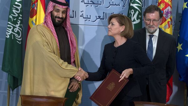 FILE - In this April 12, 2018 file photo, Saudi Arabia Crown Prince Mohammed bin Salman, left and Spain's then Defense Minister Maria Dolores Cospedal shake hands after signing bi-lateral agreements in the presence of the then Prime Minister of Spain Mariano Rajoy, right, at the Moncloa Palace in Madrid, Spain. Spain has cancelled the sale of 400 laser-guided bombs to Saudi Arabia it was reported Tuesday Sept. 4, 2018, amid fears that the weapons could be used in the Riyadh-led coalition fighting the Iran-aligned Houthi rebels in Yemen - Sputnik International