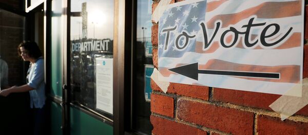 A voter leaves a polling site after casting a ballot in the Massachusetts Primary Election in Somerville, Massachusetts, U.S., September 4, 2018 A voter leaves a polling site after casting a ballot in the Massachusetts Primary Election in Somerville, Massachusetts, U.S., September 4, 2018 - Sputnik International