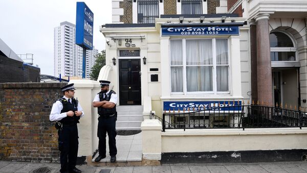Police officers stand outside the City Stay Hotel used by Alexander Petrov and Ruslan Boshirov; who have been accused of attempting to murder former Russian spy Sergei Skripal and his daughter Yulia; in London, Britain September 5, 2018 - Sputnik International