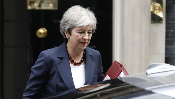 Britain's Prime Minister Theresa May leaves 10 Downing street to take part in Prime Ministers questions at the House of Commons in London on September 5, 2018. - Sputnik International
