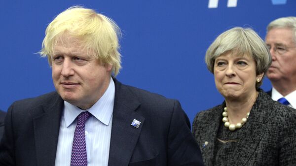 In this Thursday, May 25, 2017 file photo British Foreign Secretary Boris Johnson, left, and Britain's Prime Minister Theresa May arrive for a meeting during the NATO summit of heads of state and government, at the NATO headquarters, in Brussels. British ex-Foreign Secretary Boris Johnson has slammed Prime Minister Theresa May's Brexit policy, a move likely to fuel speculation that he is seeking to oust her. Johnson wrote in the Daily Telegraph on Monday Sept. 3, 2018 that May's so-called Chequers plan for continued ties with the European Union after Brexit will leave Britain in a weakened position - Sputnik International
