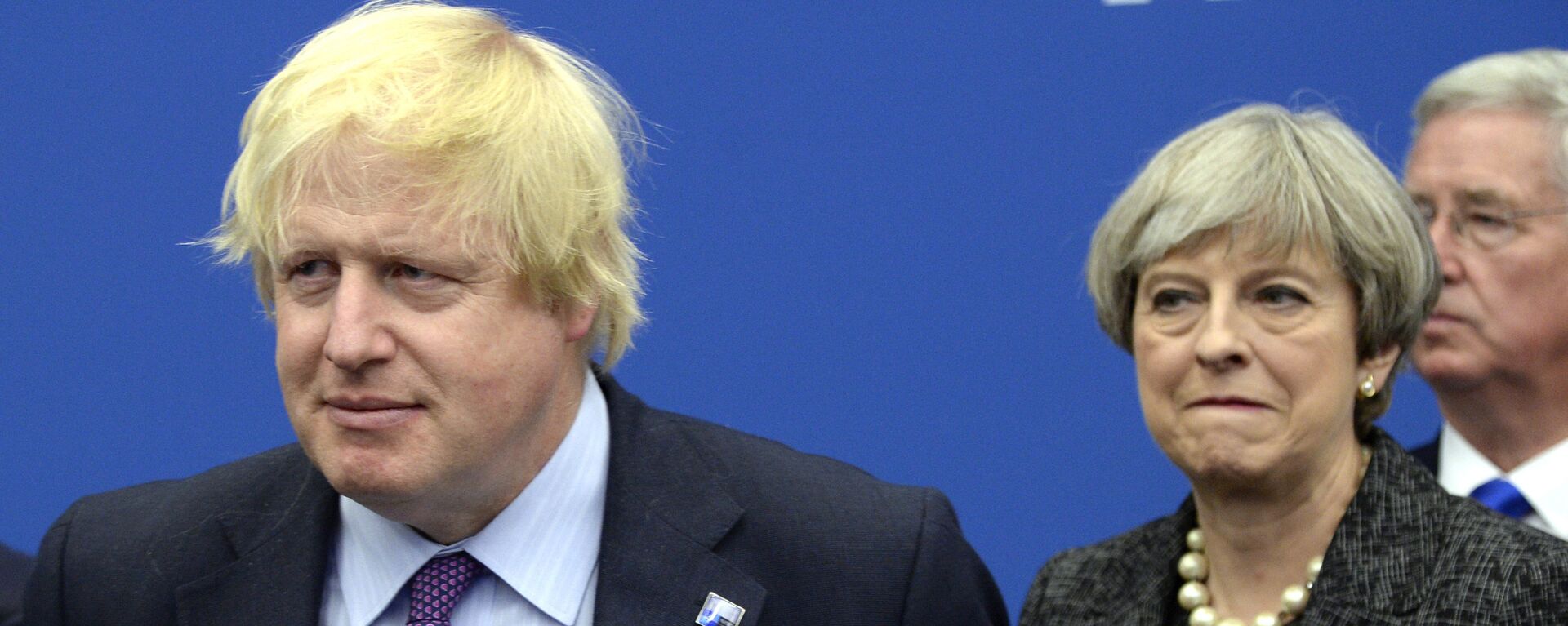 In this Thursday, May 25, 2017 file photo British Foreign Secretary Boris Johnson, left, and Britain's Prime Minister Theresa May arrive for a meeting during the NATO summit of heads of state and government, at the NATO headquarters, in Brussels. British ex-Foreign Secretary Boris Johnson has slammed Prime Minister Theresa May's Brexit policy, a move likely to fuel speculation that he is seeking to oust her. Johnson wrote in the Daily Telegraph on Monday Sept. 3, 2018 that May's so-called Chequers plan for continued ties with the European Union after Brexit will leave Britain in a weakened position - Sputnik International, 1920, 15.12.2021