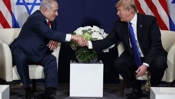 This Jan. 25, 2018 file photo shows President Donald Trump meeting with Israeli Prime Minister Benjamin Netanyahu at the World Economic Forum in Davos. There’s much to celebrate but plenty of cause for trepidation, too, as Trump and Netanyahu meet Monday, March 5, 2018 at the White House. For all his talk about brokering the “ultimate deal” between Israelis and Palestinians, Trump’s long-awaited peace plan has yet to arrive, even as Palestinians and other critics insist it will be dead on arrival - Sputnik International