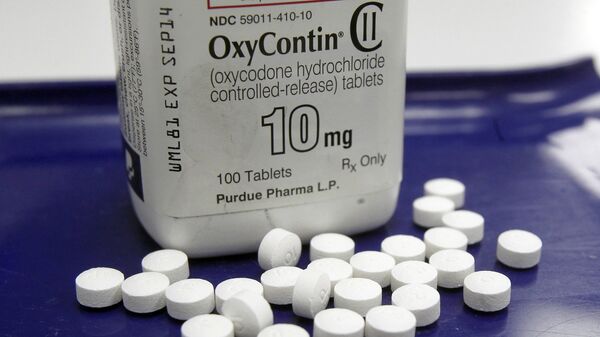 OxyContin pills arranged for a photo at a pharmacy. - Sputnik International