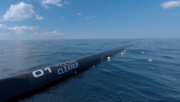 A digital image mock up of the Ocean Cleanup waterborne pollution technology. - Sputnik International