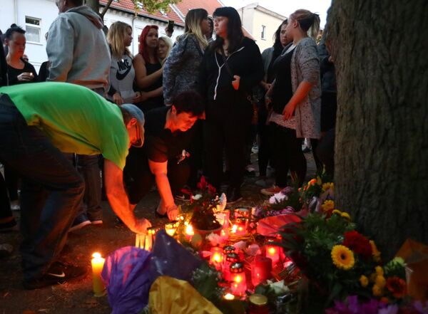 People attending a right wing protest place candles at a playground in Koethen, Germany, September 9, 2018, after a 22-year-old German man died overnight in the eastern town of Koethen and two Afghans have been detained on suspicion of killing him. People attending a right wing protest place candles at a playground in Koethen, Germany, September 9, 2018, after a 22-year-old German man died overnight in the eastern town of Koethen and two Afghans have been detained on suspicion of killing him. - Sputnik International