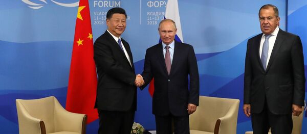 September 11, 2018. President Vladimir Putin and Chinese President Xi Jinping, left, during a meeting on the sidelines of the 4th Eastern Economic Forum at the Far Eastern Federal University on the Russky Island. Right: Foreign Minister Sergei Lavrov - Sputnik International