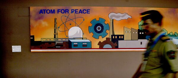 A policeman walks past a mural at the Bhabha Atomic Research Centre (BARC) Training School where Prime Minister Manmohan Singh is visiting, in Mumbai, India, Friday, Aug. 31, 2007. A policeman walks past a mural at the Bhabha Atomic Research Centre (BARC) Training School where Prime Minister Manmohan Singh is visiting, in Mumbai, India, Friday, Aug. 31, 2007. - Sputnik International