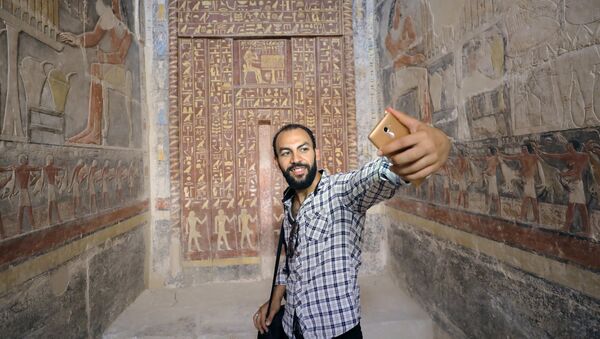 A man takes a selfie in a chamber of the tomb of Mehu, after it was opened for the public at Saqqara area near Egypt's Saqqara necropolis, in Giza, Egypt September 8, 2018. - Sputnik International