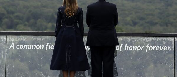 President Donald Trump and first lady Melania Trump, stand along the September 11th Flight 93 Memorial, Tuesday, Sept. 11, 2018, in Shanksville, Pa. President Donald Trump and first lady Melania Trump, stand along the September 11th Flight 93 Memorial, Tuesday, Sept. 11, 2018, in Shanksville, Pa. - Sputnik International