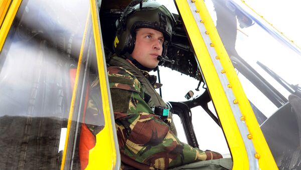Britain's Prince William is pictured at the controls of a Sea King helicopter during a training exercise at Holyhead Mountain, having flown from RAF Valley in Anglesey, north Wales, on March 31, 2011. - Sputnik International