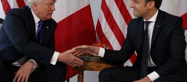 President Donald Trump shakes hands with French President Emmanuel Macron during a meeting at the U.S. Embassy, Thursday, May 25, 2017, in Brussels - Sputnik International
