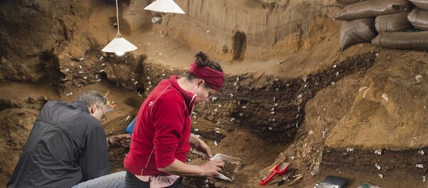 Researchers work inside Blombos Cave on South Africa's southern coast in this photo released September 12, 2018 Researchers work inside Blombos Cave on South Africa's southern coast in this photo released September 12, 2018 - Sputnik International