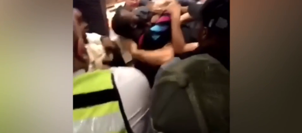 McDonald's employee is placed in headlock by customer during violent brawl in London McDonald's employee is placed in headlock by customer during violent brawl in London - Sputnik International