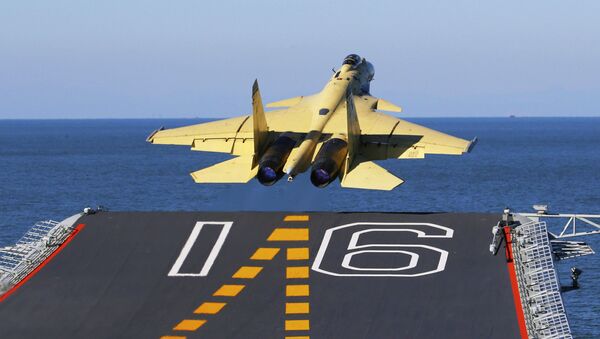 A carrier-borne J-15 fighter jet takes off from China's first aircraft carrier, the Liaoning (File) - Sputnik International