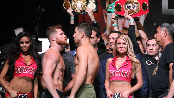 Boxers Canelo Alvarez (L) and Gennady Golovkin face-off during their weigh-in at the MGM Grand Hotel & Casino on September 15, 2017 in Las Vegas, Nevada - Sputnik International