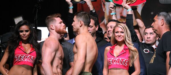 Boxers Canelo Alvarez (L) and Gennady Golovkin face-off during their weigh-in at the MGM Grand Hotel & Casino on September 15, 2017 in Las Vegas, Nevada Boxers Canelo Alvarez (L) and Gennady Golovkin face-off during their weigh-in at the MGM Grand Hotel & Casino on September 15, 2017 in Las Vegas, Nevada - Sputnik International