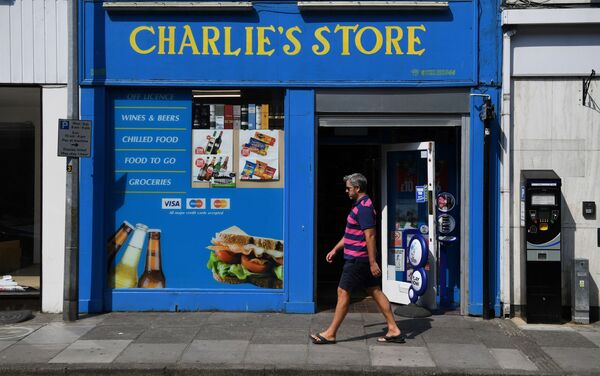 A pedestrian walks past a newsagent shop, one of the last places visited by 44-year old Dawn Sturgess before she fell ill on June 30, in Salisbury - Sputnik International