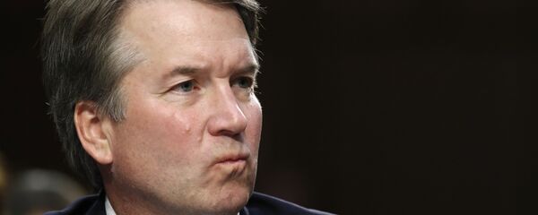 President Donald Trump's Supreme Court nominee, Brett Kavanaugh, listens to a question during the third round of questioning on the third day of his Senate Judiciary Committee confirmation hearing, Thursday, Sept. 6, 2018, on Capitol Hill in Washington, to replace retired Justice Anthony Kennedy. - Sputnik International