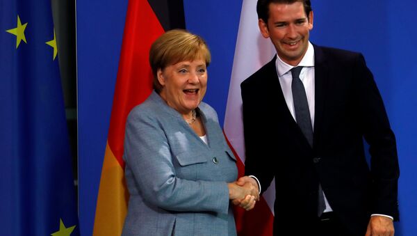 German Chancellor Angela Merkel and Austrian Chancellor Sebastian Kurz shake hands after giving a statment to the media in the chancellery in Berlin, Germany, September 16, 2018. - Sputnik International