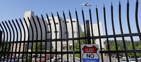 The Federal Detention Center where Blanca Orantes-Lopez is held some 3,000 miles away from her child is seen behind a fence as a jet flies overhead Tuesday, June 19, 2018, in SeaTac, Wash The Federal Detention Center where Blanca Orantes-Lopez is held some 3,000 miles away from her child is seen behind a fence as a jet flies overhead Tuesday, June 19, 2018, in SeaTac, Wash - Sputnik International