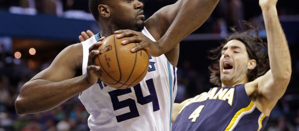 Charlotte Hornets' Jason Maxiell (54) grabs a rebound over Indiana Pacers' Luis Scola (4) during the first half of an NBA basketball game in Charlotte, N.C., Sunday, Feb. 8, 2015 Charlotte Hornets' Jason Maxiell (54) grabs a rebound over Indiana Pacers' Luis Scola (4) during the first half of an NBA basketball game in Charlotte, N.C., Sunday, Feb. 8, 2015 - Sputnik International
