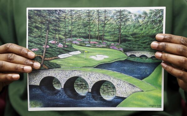 Dixon holds one of his golf course drawings. He said he had never been into golf before going to jail Dixon holds one of his golf course drawings. He said he had never been into golf before going to jail - Sputnik International