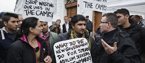 Some thirty Syrian refugees from different camps seeking asylum hold banners outside the Swedish Embassy in Copenhagen, Denmark on Wednesday, Sept. 26, 2012 Some thirty Syrian refugees from different camps seeking asylum hold banners outside the Swedish Embassy in Copenhagen, Denmark on Wednesday, Sept. 26, 2012 - Sputnik International